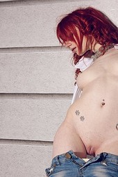 Tattooed Redhead Girl Melanie Strips And Shows Her Nice Tits