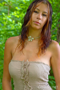 Busty girl posing outdoors