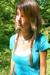 Busty teen brunette shows her boobs