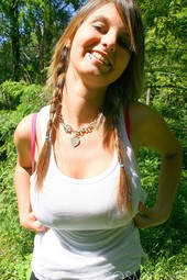 Busty teen brunette shows her boobs