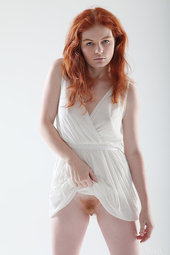 Redhead teen posing nude