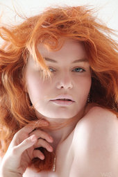 Redhead teen posing nude
