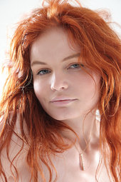 Redhead teen posing nude